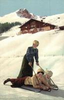 Winter sport, sledding with woman controlling the direction