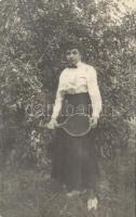 1916 Lady with tennis racket. photo