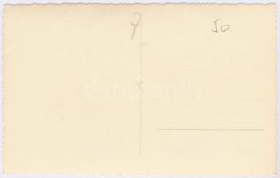 Tisztviselők, hivatalnokok csoportképe Adolf Hitler portréja előtt, horogkeresztes zászlók / Officer...