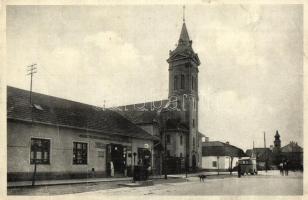 Zselíz, Zeliezovce; utcakép, Református templom, autóbusz, Róth Márk üzlete, utcai benzintöltő állomás. Kiadja a Garamvölgyi Papíráruház / street view, Calvinist church, autobus, shops, gas filling station (EB)