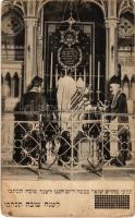 Jewish New Year ceremony in the synagogue with rabbis. Hebrew text (EK)