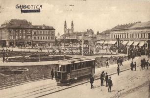 Szabadka, Subotica; Szent István tér, utcakép, villamos, üzletek. Kiadja Heumann Mór / street view with tram and shops (EK)