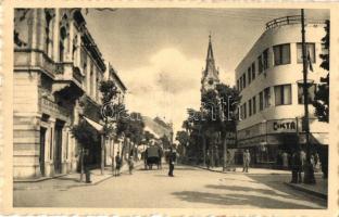 Komárom, Komárno; Nádor utca, Cikta üzlet, Első Magyar Biztosító rt. fiókja, templom, Otthon kávéház, kerékpáros / street view, shops, insurance company, church, café, bicycle