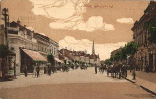 Losonc, Lucenec; Rákóczi utca, üzletek, férfi kerékpárral. Kiadja Bicskei Zoltán / street view with shops, man with bicycle (EK)