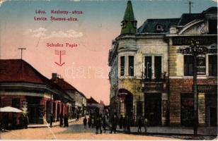 Léva, Levice; Kazinczy utca, Osztrák-magyar bank, Fonciere pesti biztosító, Borcsányi üzlete, Schulz Ignác papírüzlete és saját kiadása / Sturova ulica / street view with Austro-Hungarian bank, insurance company and shops 1938 Komárom visszatért So. Stpl (fa)