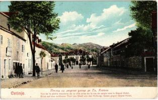 Cetinje, Cettigne; Blick auf den mittleren Theil der Stadt von der Hofburg-Gasse gegen Grand Hotel / street view with hotel, shop. Verlag N. S. Bjeladinovic