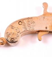 Bizsu pisztoly medál, láncon, játék puskatöltővel