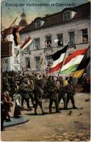 Einzug der Verbündeten in Czernowitz / Entry of the allies in Chernivtsi. Viribus Unitis. WWI K.u.K. military art postcard with flags
