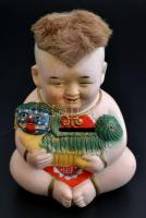 Gyermek nevető Buddha persely, ragasztott hajjal, kézzel festett, kopás nyomokkal, apró lepattanássa...