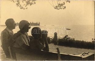 Balatonfüred, család a padon ülve naplementében. photo