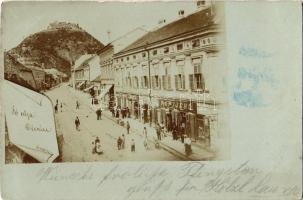 1900 Déva, Fő utca, vár, Pap Jenő, Lengyel és Schuleri Fritz üzlete / main street with shops, castle. Péntek E. photo