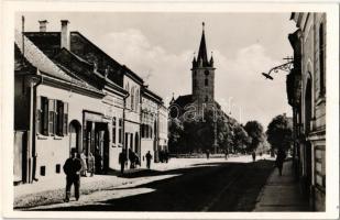 Szászrégen, Reghin; Gróf Csáky utca, Szász templom, Graft Philippi üzlete / street view, Lutheran church, shop