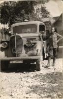 1943 Magyar katona egy teherautó mellett Gyergyószentmiklóson / WWII Hungarian soldier next to a truck in Sfantu Gheorghe. photo (EK)