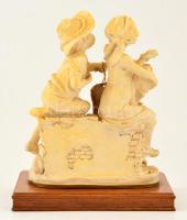 Jelzett (G.A) udvarló kisfiú, műgyanta, apró repedéssel, fa talapzaton, m: 22 cm