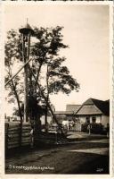 Szentegyháza, Szentegyházas-Oláhfalu, Szentegyházasfalva, Vlahita; utcakép, ökrös szekér, harang, Székely kapu / street view with bell, Székely gate and oxen cart. Kováts István photo