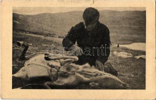 Eskimo hunter skinning a deer, folklore (small tear)