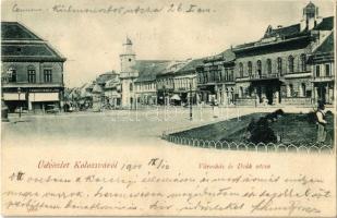 1900 Kolozsvár, Cluj; Városháza és Deák utca, Tamási Tamás és Fia, Stief Jenő és Társa üzlete, kávéház, Evangélikus templom, növények locsolása slaggal / town hall, street view, shops, café, Lutheran church, man watering the plants with hose