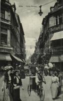 1909 Köln, Cologne; Hohe Strasse / street view, shops, montage with postman and ladies. Verlag B. & M. Wollstein