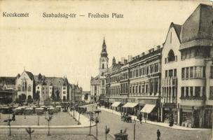 Kecskemét, Szabadság tér, Városháza, üzletek, piaci árusok, drogéria (gyógyszertár). Kiadja Fekete Soma (EK)