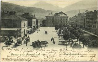 1900 Innsbruck, Bahnhofsplatz / square, railway station, horse-drawn carriages (wet corners)