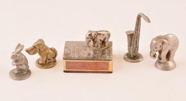 Cigaretta eloltására használt fém hamutartó figura (elefánt, kutya, nyúl, szaxofon), és egy elefánt figurás fém gyufásdoboz-borító, 5 db, 6 cm és 3,5 cm közötti méretben, gyufásdoboz-borító: 5x4x1,5 cm, m: figurával együtt: 4,5 cm