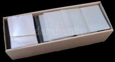 Egy doboznyi (kb. 1500 db) műanyag képeslaptartó tok / A box of plastic postcard holder cases, Cca. 1500 pieces