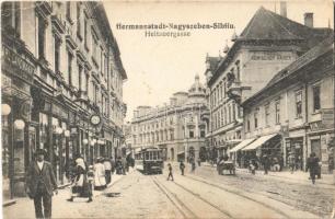 1918 Nagyszeben, Hermannstadt, Sibiu; Disznódi utca, villamos, Római császár szálloda, Jul. Rosenbath és Carl Landmann üzlete / Heltauergasse / street, shops, tram  (EB)