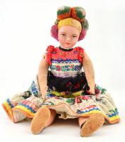 Népviseletes, hímzett ruhájú baba, arca kézzel festett. Koszos. m: 40 cm