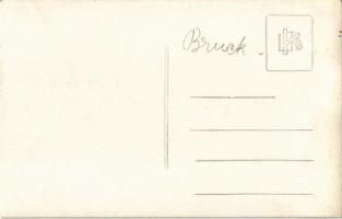 Bruck an der Mur, street view, gas pump, clock tower, shops, automobile and motorcycle repair garage...