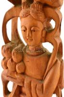 Keleti termékenységi istennő és sárkány szobor. Faragott fa. 33 cm