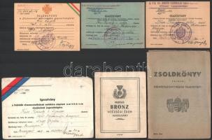 1939-1944 Fényképes zsoldkönyv karpaszományos szakaszvezető részére, m. kir. 2. honvéd szaklégvédelmi jelző üteg parancsnokság, benne 5 db kitüntetés viselésére jogosító igazolvánnyal (Bronz vitézségi érem, Tűzkereszt, Felvidék visszacsatolása, Délvidék visszafoglalása, Keletmagyarország és Erdély egy részének felszabadulása), valamint 1 db igazolvány tényleges katonai szolgálatról, és egy meghatalmazás, az igazolványok egy részén m. kir. 101. honvéd légvédelmi tüzér osztály bélyegzésekkel.