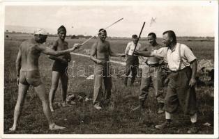 1944 Máramaros, Maramures; munkaszolgálatos katonák pihenés közben, játék botokkal / WWII Hungarian military, forced labor camp soldiers during rest, playing with sticks. photo