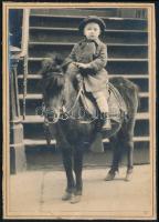 cca 1920 Kisfiú pónilovon, kartonra kasírozott fotó, kis hibákkal, 15×10,5 cm