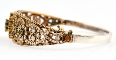 Aranyozott ezüst(Ag) kövekkel gazdagon kirakott karperec, jelzett, 6×5,5 cm, bruttó: 23,3 g