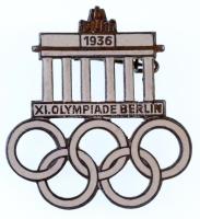 Német Harmadik Birodalom 1936. "XI. Olimpia Berlin" zománcozott olimpiai jelvény, hátlapon "PAUL MANN & CRON - LÜDENSCHEID" gyártói jelzéssel (30x33mm) T:2  1936. "XI. Olympiade Berlin" enamelled Olympic badge, with PAUL MANN & CRON - LÜDENSCHEID" maker's mark (30x33mm) C:XF