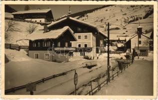 1936 Spielberg (near Saalbach-Hinterglemm), street view in winter, shop of Josef Riedlsperger. Karl Haidinger Photograph (crease)