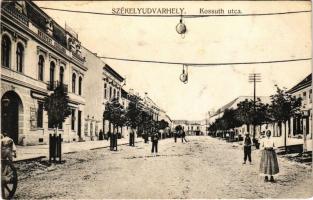 Székelyudvarhely, Odorheiu Secuiesc; Kossuth utca, Budapest szálloda / street, hotel + M. kir. I. Népfölkelő huszár ezred gazdasági hivatala (fa)