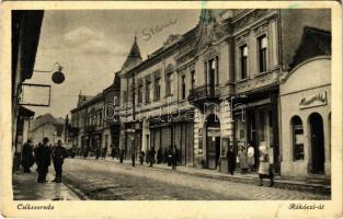 1942 Csíkszereda, Miercurea Ciuc;  Rákóczi út, Bakcsi Károly üzlete, magyar katona. Péter F. kiadása / street view, shops, Hungarian soldier (kis szakadás / small tear)