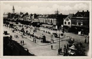 Marosvásárhely, Targu Mures; Vedere din Piata Regele Ferdinand / Fő tér, Vámos üzlete, automobil , Révész Béla nyomdája és saját kiadása / main square, shops, printing house, automobile