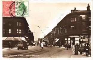 1929 Huddersfield, John William Street, automobile, tram, shops. TCV card