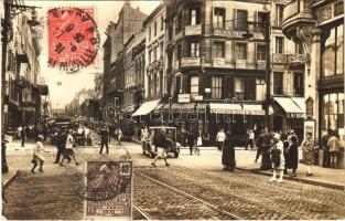 1931 Nancy, La ville aux Portes dOr, Point Central / street view, automobiles, policeman, shops. TCV card