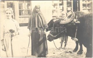 Turkish woman in Macedonia, ox cart. photo