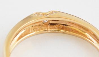 Arany (Au) 14K gyűrű, brill kövekkel, a nagy cca 0,08 ct, a 10 kisebb összesen cca 0,1 ct, jelzett, ...
