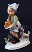 Kisfiú a kutyával és tortával, porcelán figura, kézzel festett, alján formaszámmal és Germany felirattal jelzett, apró kopásnyomokkal, h: 14,5 cm