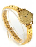 Universal női 14K aranyóra, fám szíjjal. Működő állapotban. d: 2 cm