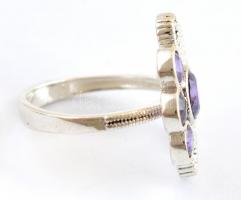 Ezüst(Ag) virágos gyűrű, markazittal és lila kővel, jelzett, méret: 55, bruttó: 5,28 g