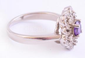 Ezüst(Ag) virágos gyűrű, lila kővel, jelzett, méret: 52, bruttó: 4,1 g