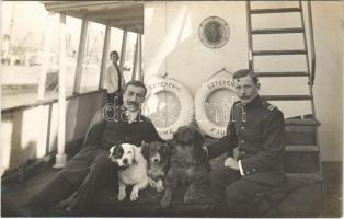 Jurányi tengerészkapitány a "SZTERÉNYI" (Atlantica Tengerhajózási Rt. Fiume) egycsavaros tengeri áruszállító gőzhajó fedélzetén kutyákkal / Hungarian sea captain with dogs on board of the "SZTERÉNYI" (Atlantica Sea Navigation Ltd. Fiume) cargo steamship. photo