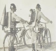 cca 1930 2 db tűzoltó biciklin, fotó, üvegezett keretben, 11x16 cm, 16x11 cm