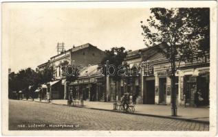 1935 Losonc, Lucenec; Masarykova ul. / Masaryk utca, J. Paulovic, Marcel Filó könyvkötő, Engel István üzlete, kerékpár / street view, shops, bicycle